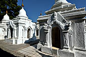 Myanmar - Mandalay, Kuthodaw Pagoda. 729 white pitaka pagodas contain the Tipitaka, the sacred texts of Theravada Buddhism. 